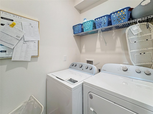 washroom featuring washing machine and clothes dryer