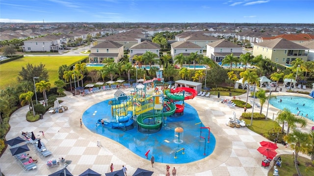 view of swimming pool with a playground