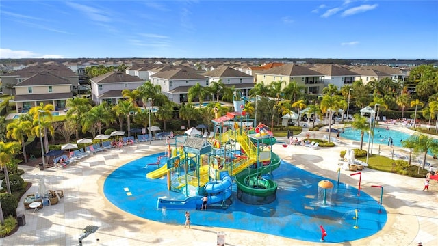 view of pool with a playground