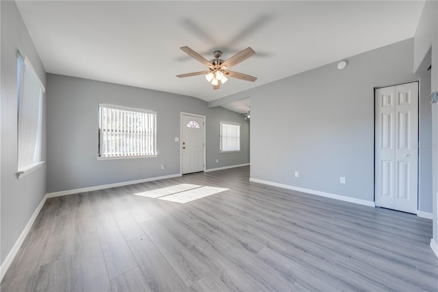 spare room featuring ceiling fan and light hardwood / wood-style floors