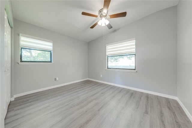 unfurnished room featuring ceiling fan, plenty of natural light, and light hardwood / wood-style flooring