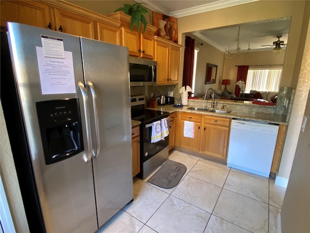 kitchen featuring stainless steel appliances, ceiling fan, crown molding, sink, and light tile patterned flooring