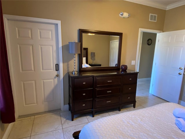 bedroom featuring light tile patterned floors and ornamental molding