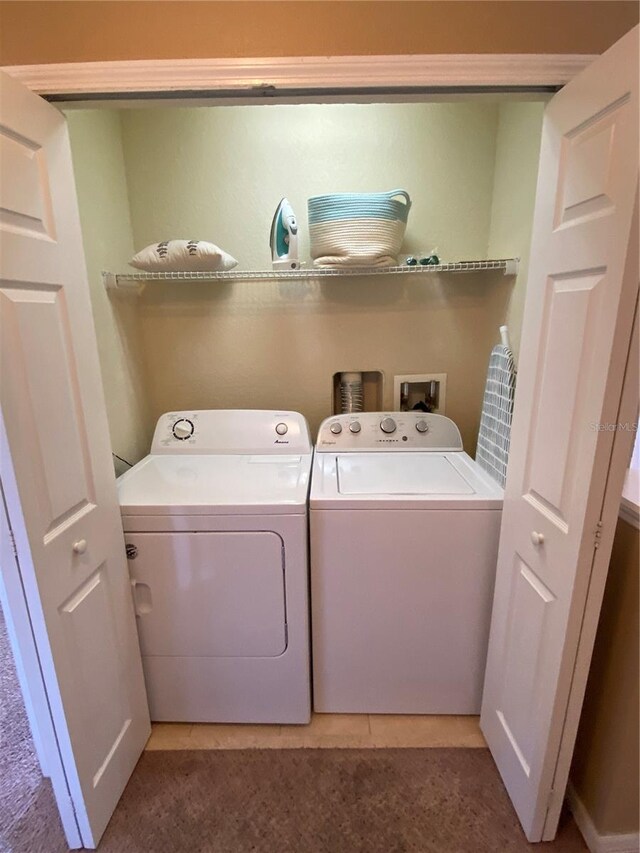 467 La Mirage St, Davenport, FL 33897 - laundry area featuring washer and clothes dryer and light colored carpet