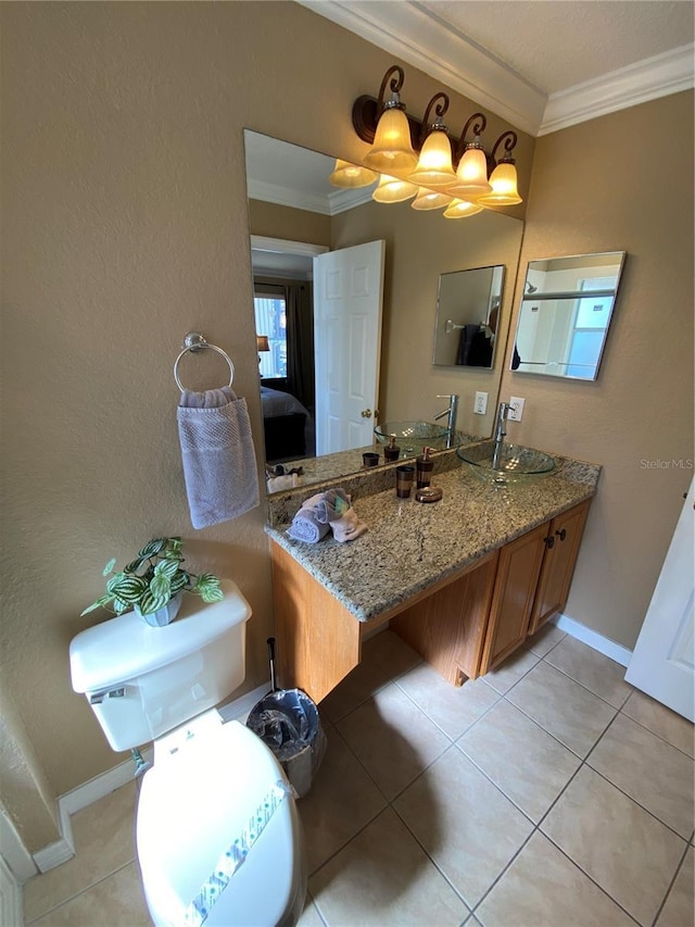 bathroom with tile patterned flooring, vanity, and ornamental molding