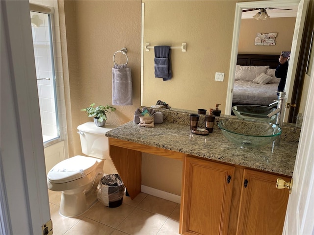 bathroom featuring tile patterned floors, vanity, and toilet