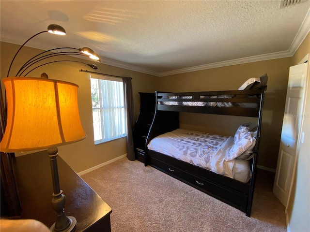 bedroom with carpet floors, a textured ceiling, and ornamental molding