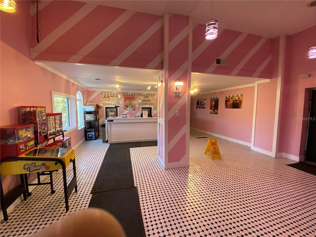 interior space with carpet flooring and high vaulted ceiling