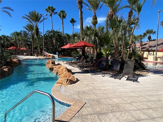 view of pool featuring a patio