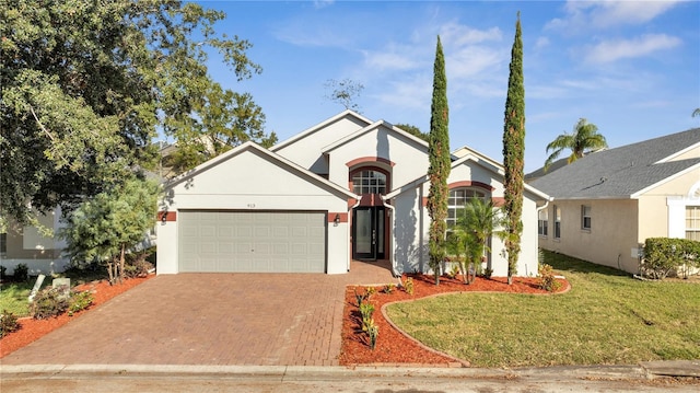 view of front of house featuring a front yard and a garage