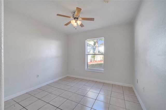 tiled empty room with ceiling fan