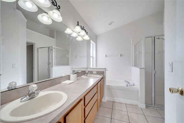 bathroom with tile patterned floors, vanity, separate shower and tub, and lofted ceiling