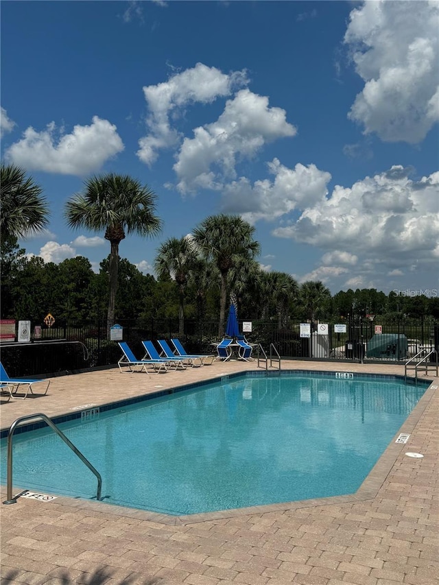 view of swimming pool featuring a patio