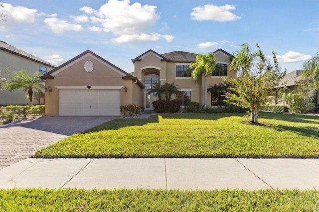 view of front of home featuring a front yard and a garage