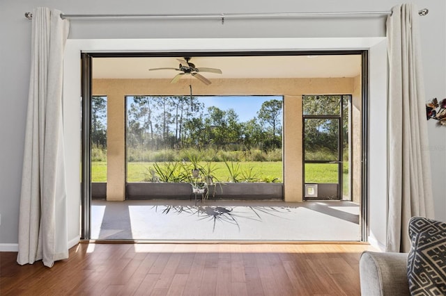 entryway with hardwood / wood-style flooring and ceiling fan