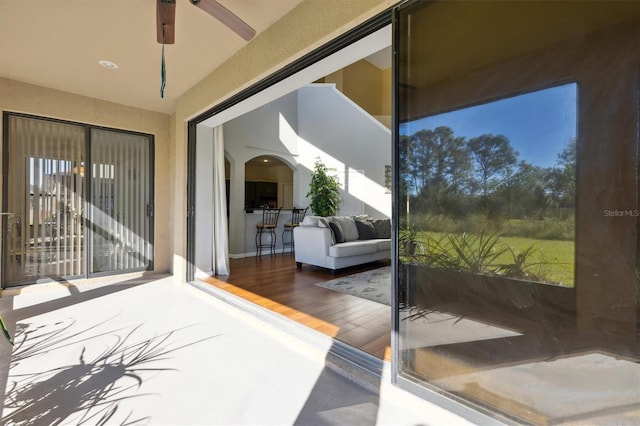 sunroom with ceiling fan and a healthy amount of sunlight