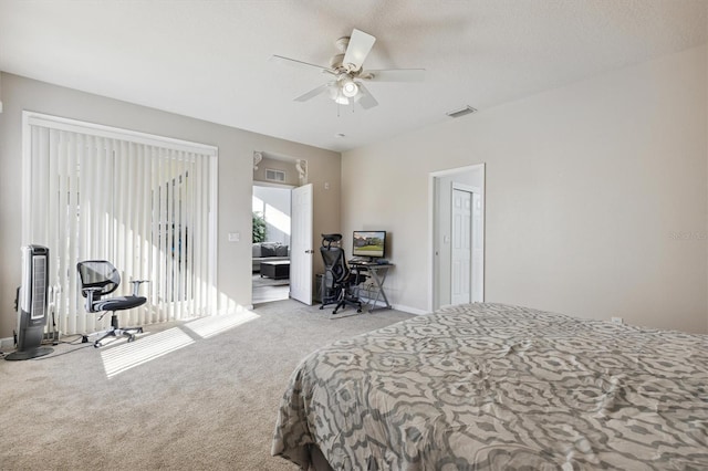 bedroom with ceiling fan and light carpet