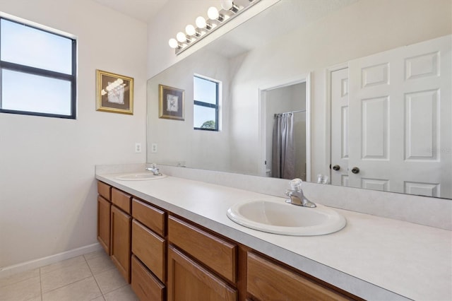 bathroom featuring tile patterned floors, curtained shower, and vanity