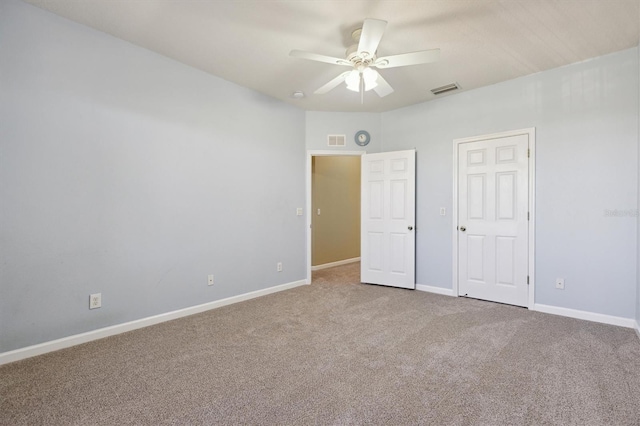 unfurnished bedroom featuring carpet and ceiling fan