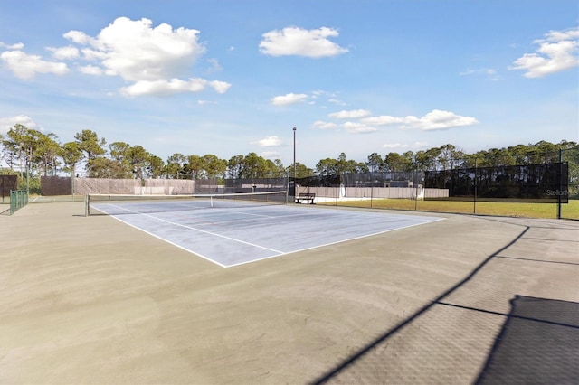 view of sport court featuring basketball hoop