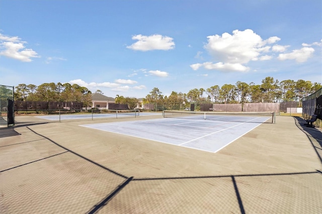 view of tennis court featuring basketball court