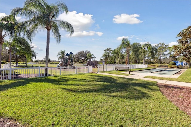 surrounding community featuring a yard and a playground