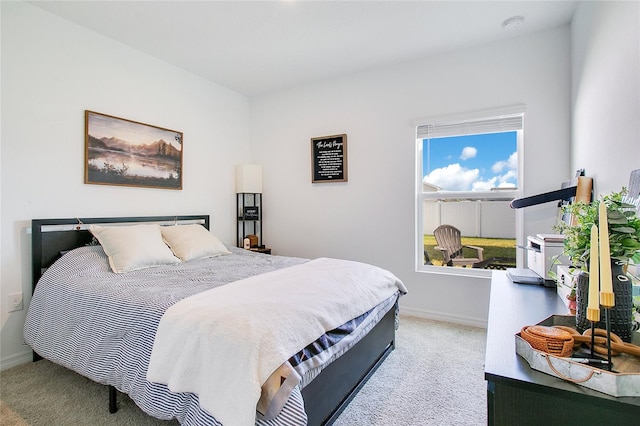 bedroom with light carpet