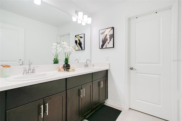 bathroom with tile patterned floors and vanity