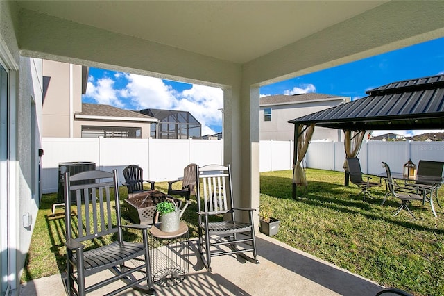 view of patio featuring a gazebo, a fire pit, and central air condition unit