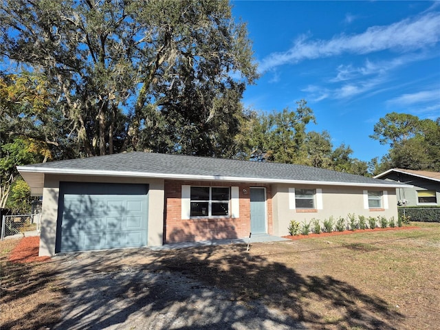 single story home featuring a garage