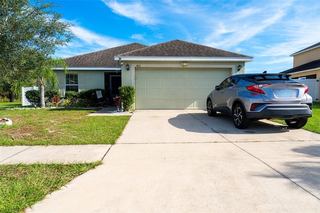 ranch-style home with a front yard and a garage