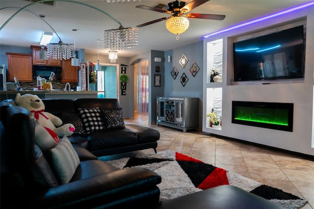 tiled living room featuring ceiling fan