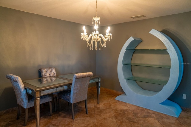 dining area featuring a chandelier