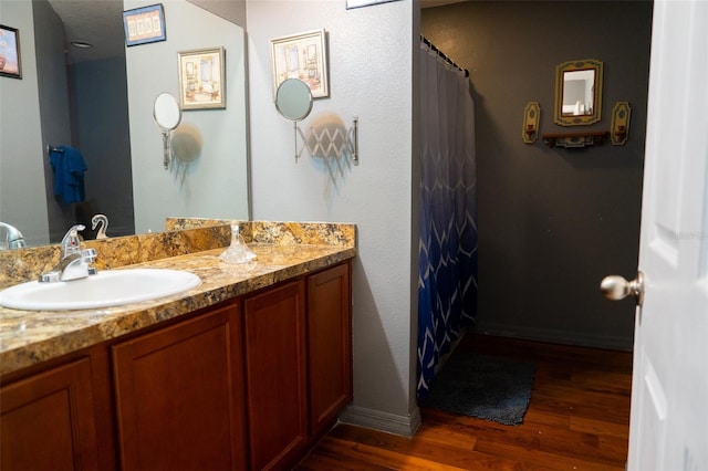 bathroom with vanity and hardwood / wood-style flooring