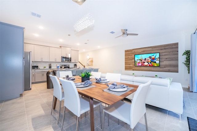 tiled dining room with ceiling fan