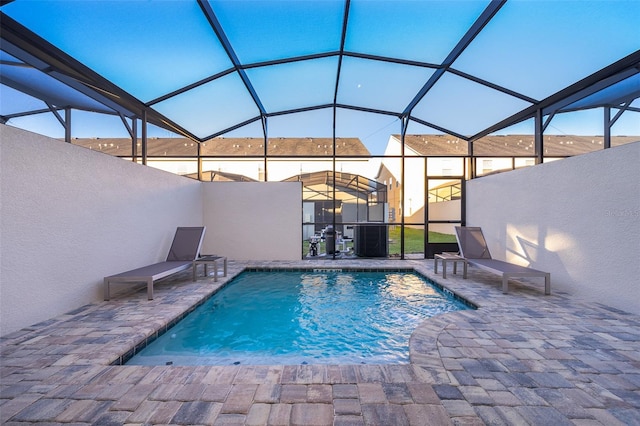 view of pool featuring a patio and a lanai