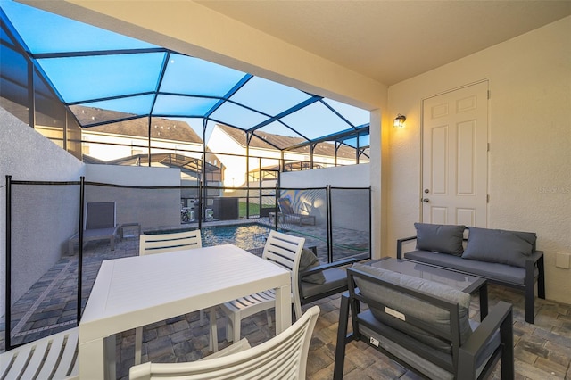 view of patio / terrace featuring an outdoor hangout area and a lanai