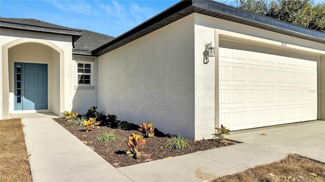 view of side of home with a garage