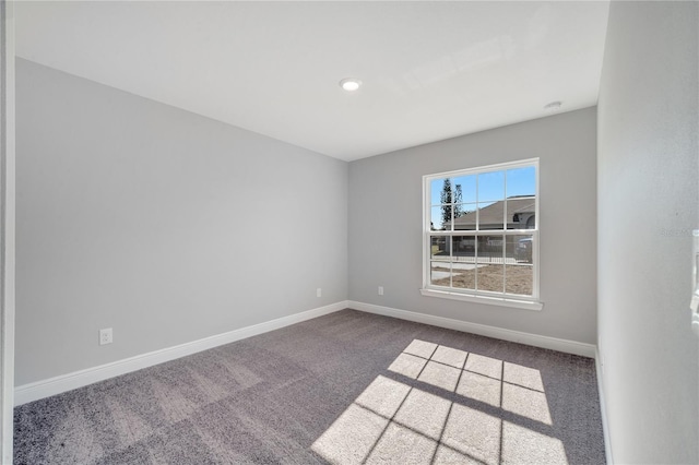 unfurnished room featuring carpet