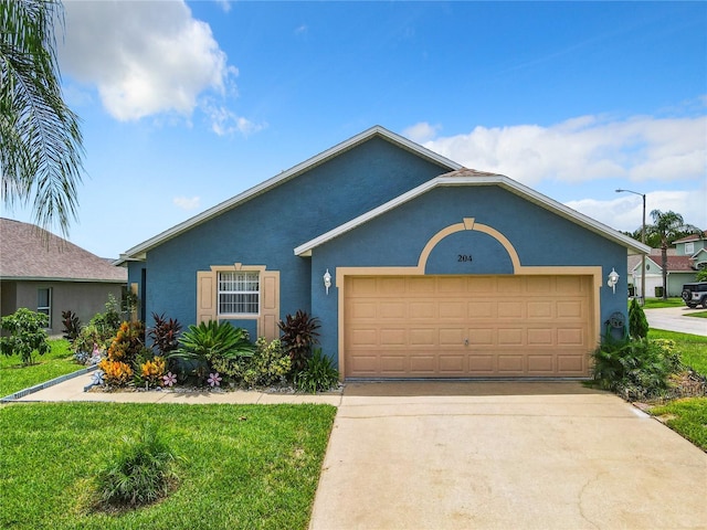 view of front of property with a garage and a front lawn