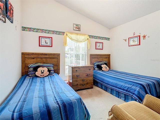 carpeted bedroom featuring vaulted ceiling