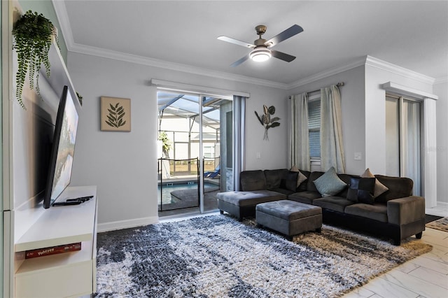 living room featuring ceiling fan and crown molding