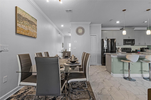 dining space with crown molding and a textured ceiling