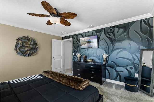 carpeted bedroom with a textured ceiling, ceiling fan, and crown molding