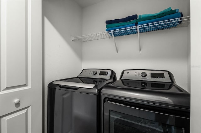 laundry area with washer and clothes dryer