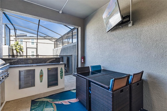 view of patio featuring a lanai