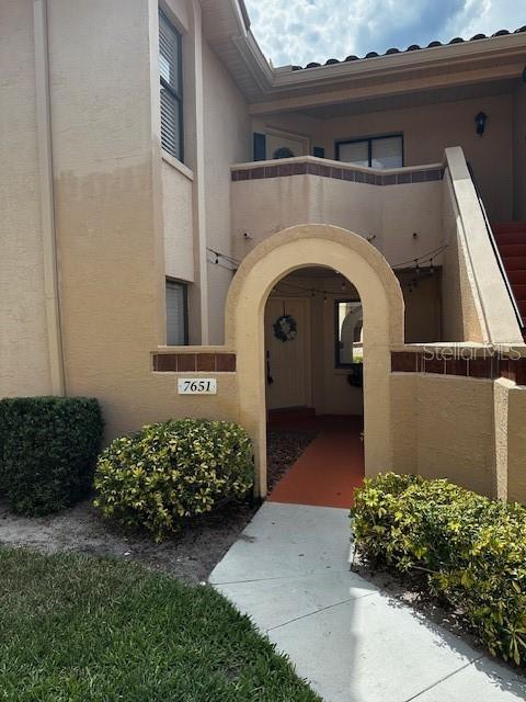 entrance to property with a balcony