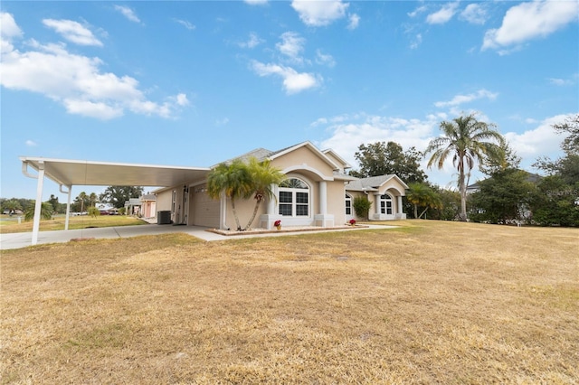 ranch-style home with a carport, a front yard, and cooling unit