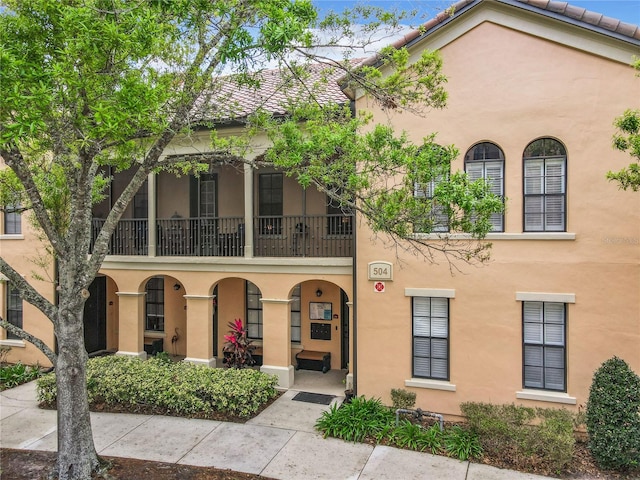 view of front of home with a balcony