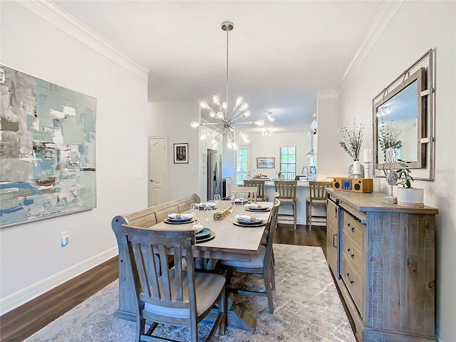 dining room featuring an inviting chandelier, dark wood-type flooring, and crown molding